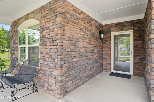 doorway to property with covered porch