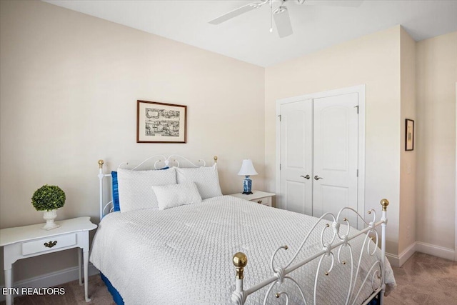 bedroom featuring a closet, baseboards, carpet floors, and ceiling fan