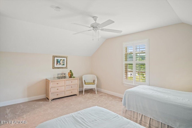 bedroom with baseboards, carpet, lofted ceiling, and ceiling fan