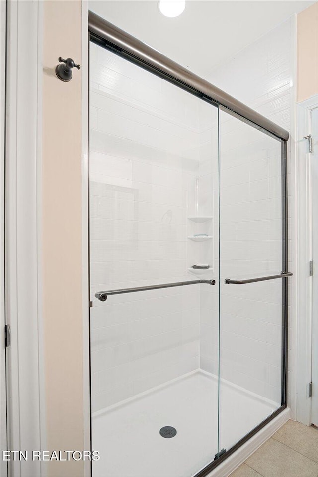 bathroom featuring a shower stall