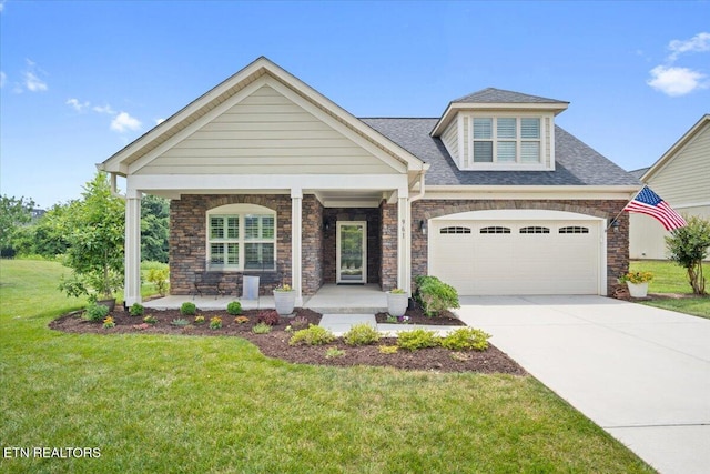 view of front of property featuring a shingled roof, a front lawn, a porch, concrete driveway, and a garage