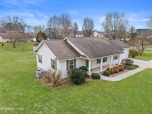 view of home's exterior with a lawn, driveway, central AC, roof with shingles, and a garage