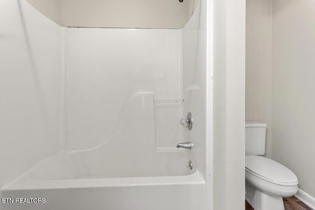 full bathroom featuring toilet and washtub / shower combination