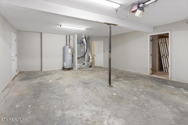 interior space with heating unit, electric water heater, and a garage door opener