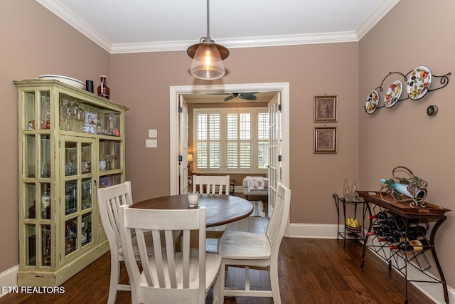 dining area with ornamental molding, baseboards, and wood finished floors