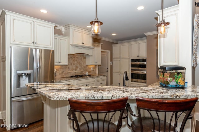 kitchen with light stone counters, a peninsula, ornamental molding, appliances with stainless steel finishes, and tasteful backsplash