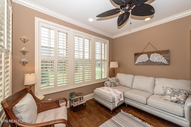 living room with baseboards, a ceiling fan, wood finished floors, and crown molding