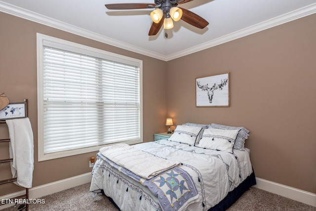 bedroom with ornamental molding, a ceiling fan, baseboards, and carpet floors