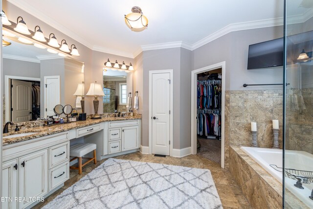 bathroom featuring a sink, ornamental molding, and double vanity