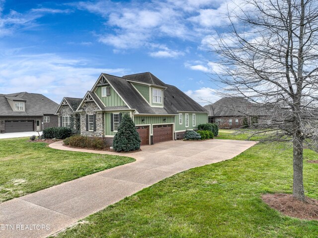 craftsman house with driveway, board and batten siding, a front yard, a shingled roof, and a garage