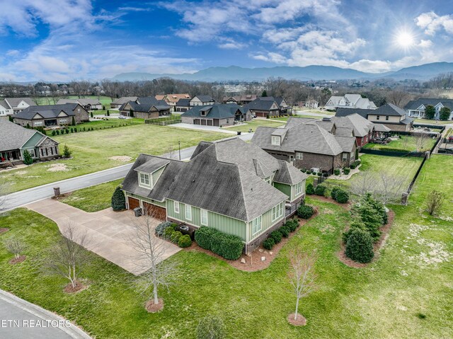 bird's eye view featuring a mountain view and a residential view