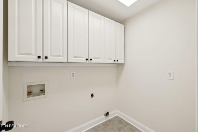 laundry room with tile patterned flooring, baseboards, washer hookup, cabinet space, and hookup for an electric dryer