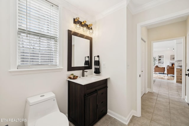 bathroom featuring vanity, baseboards, crown molding, toilet, and tile patterned floors