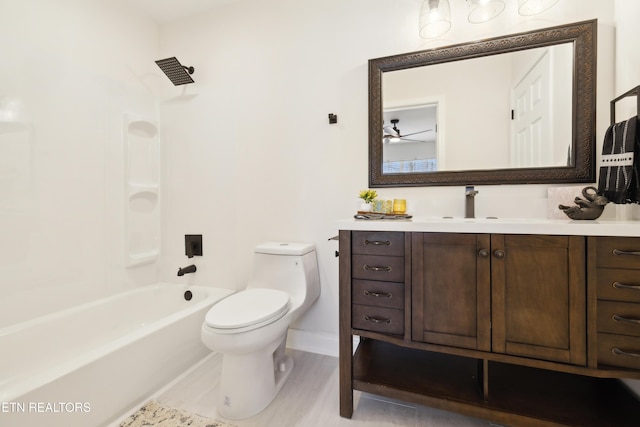 bathroom with vanity, shower / tub combination, and toilet