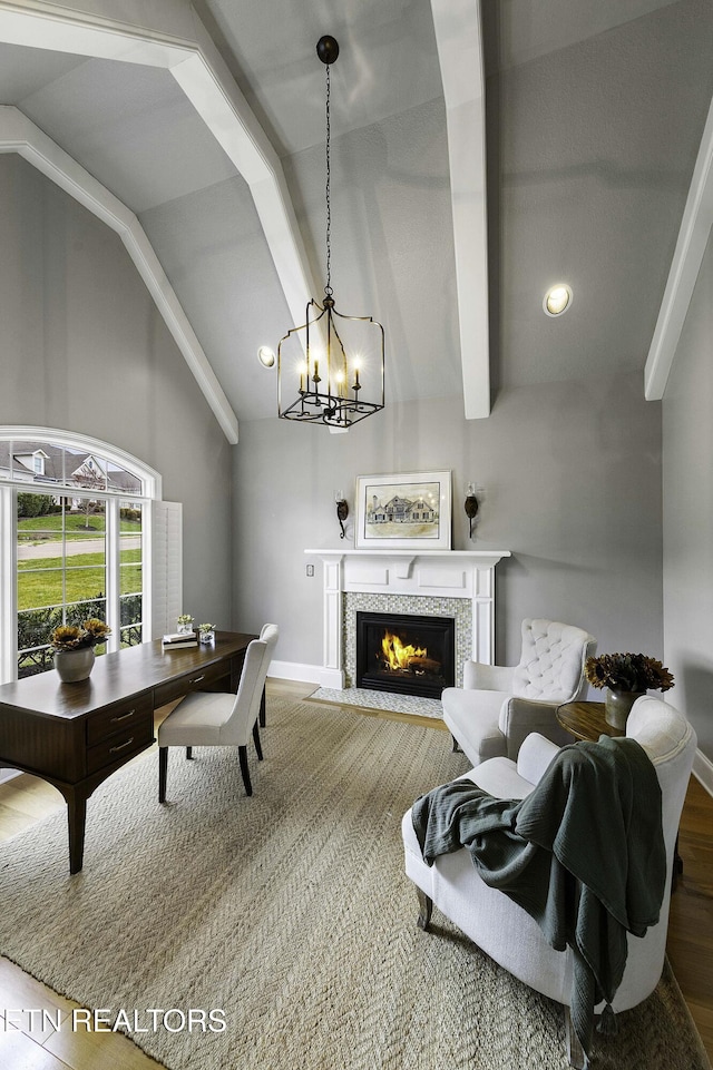 interior space featuring lofted ceiling with beams, recessed lighting, an inviting chandelier, baseboards, and a tile fireplace