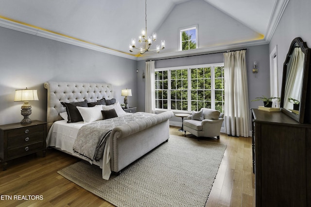 bedroom featuring a notable chandelier, ornamental molding, high vaulted ceiling, and wood finished floors