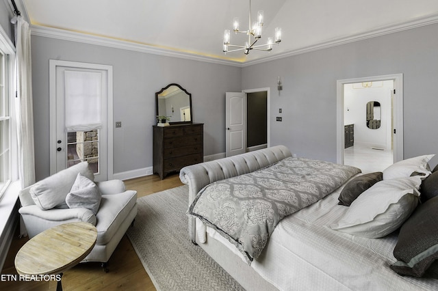 bedroom with crown molding, an inviting chandelier, and wood finished floors