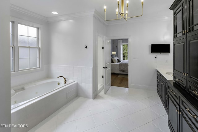 bathroom featuring tile patterned floors, a tub with jets, ensuite bath, and crown molding