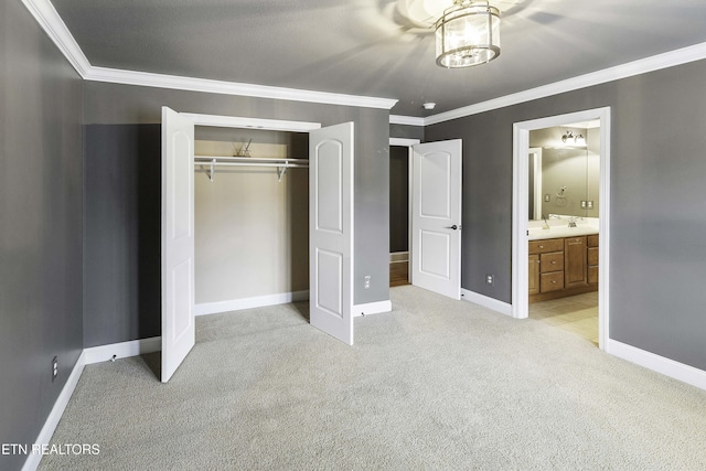 unfurnished bedroom featuring crown molding, baseboards, a closet, and light carpet