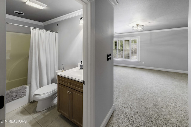 full bathroom featuring vanity, toilet, baseboards, and ornamental molding