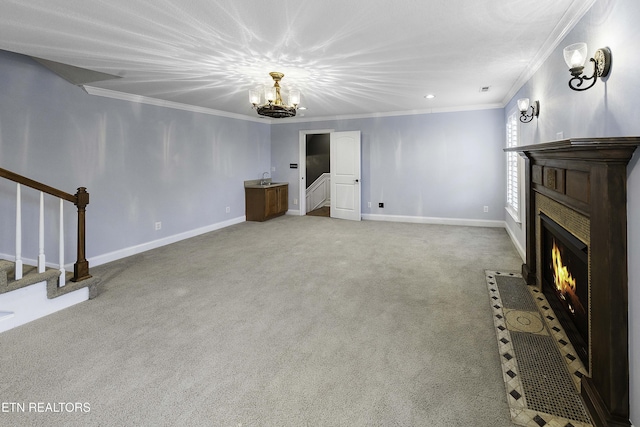 unfurnished living room with stairway, a fireplace with flush hearth, and ornamental molding