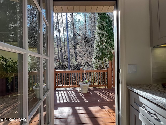 doorway to outside with wood finished floors