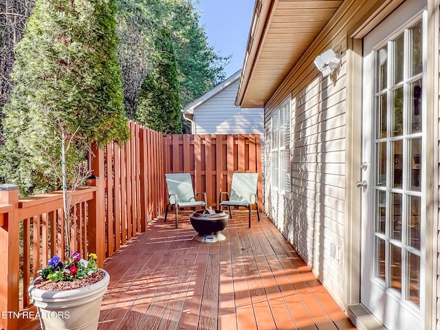 wooden deck featuring fence