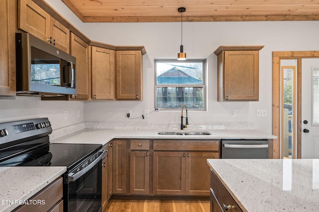 kitchen with a sink, stainless steel appliances, wooden ceiling, light stone countertops, and hanging light fixtures