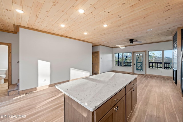 kitchen with ceiling fan, wooden ceiling, open floor plan, and light wood-type flooring