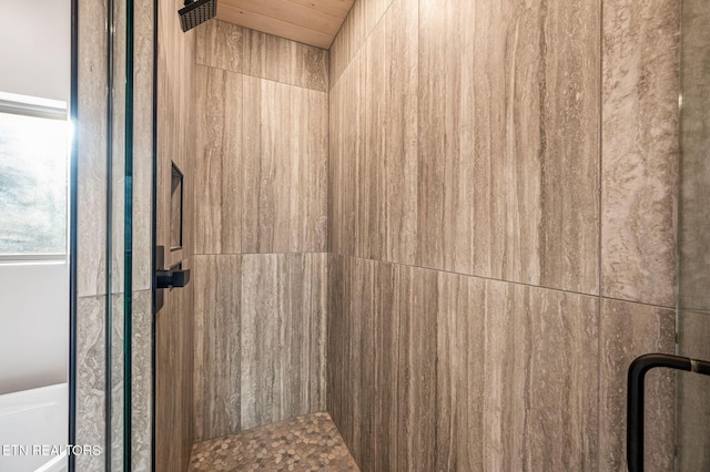 interior space featuring a tile shower