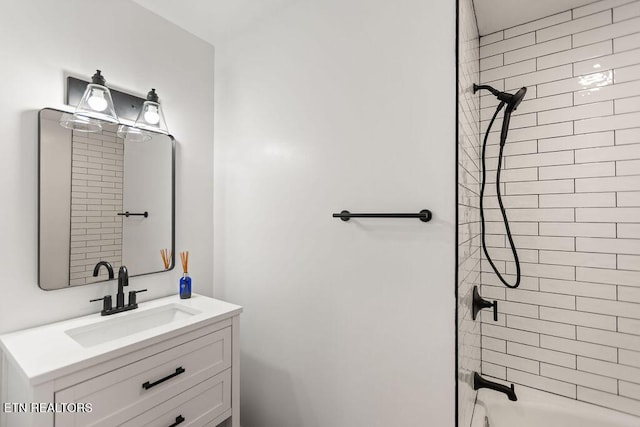 bathroom featuring vanity and tub / shower combination