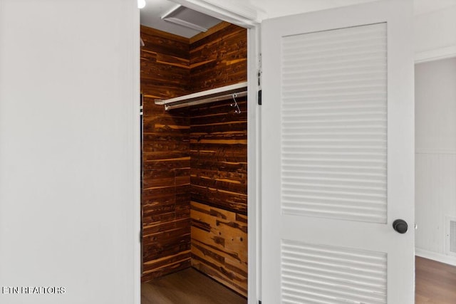 spacious closet featuring wood finished floors and visible vents