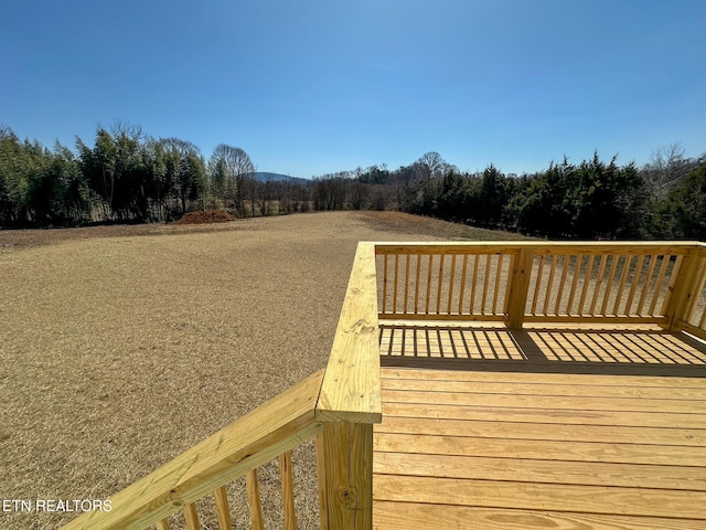 deck featuring a forest view