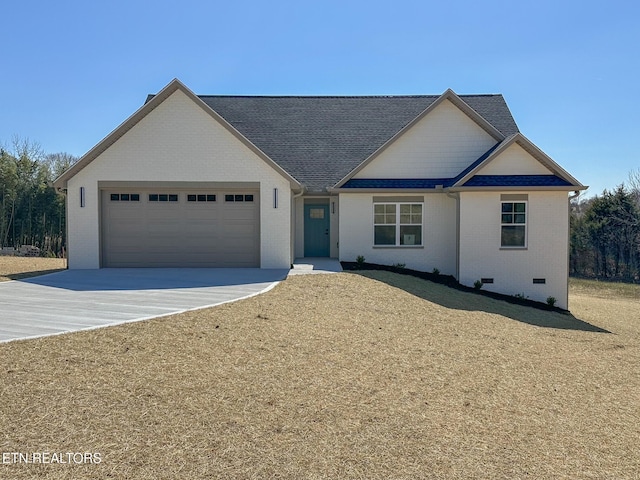 view of front of house featuring a garage, concrete driveway, a shingled roof, crawl space, and brick siding