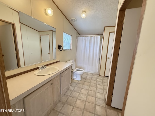 full bathroom featuring curtained shower, toilet, vanity, vaulted ceiling, and a textured ceiling