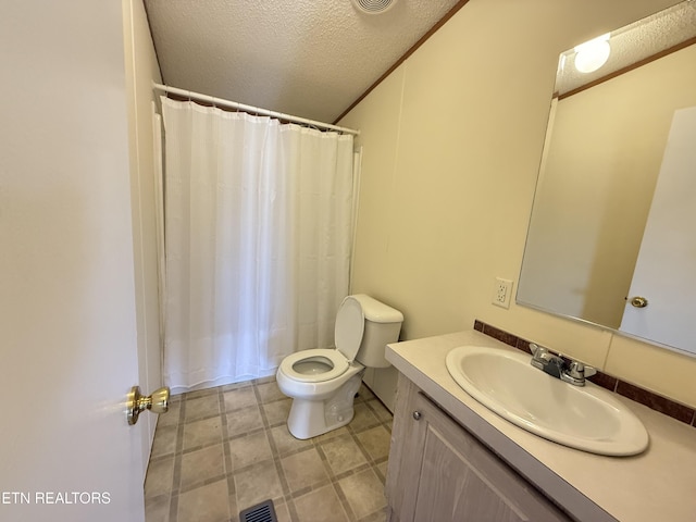 full bathroom featuring visible vents, crown molding, toilet, vanity, and a textured ceiling