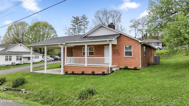108 Burke St, Pennington Gap, VA 24277 - view of front of home with central AC, a front yard, a porch, a chimney, and an attached carport