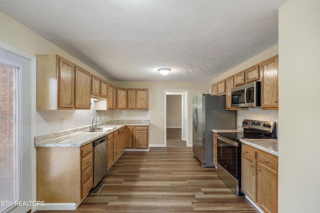 108 Burke St, Pennington Gap, VA 24277 - kitchen featuring baseboards, light countertops, appliances with stainless steel finishes, a sink, and wood finished floors