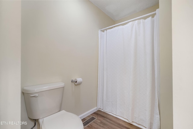 108 Burke St, Pennington Gap, VA 24277 - bathroom featuring visible vents, baseboards, toilet, and wood finished floors