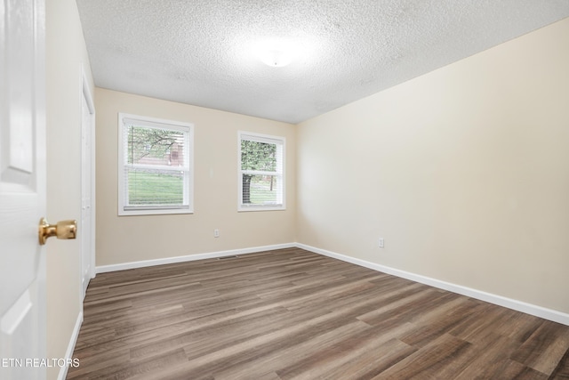 108 Burke St, Pennington Gap, VA 24277 - empty room with a textured ceiling, baseboards, and wood finished floors