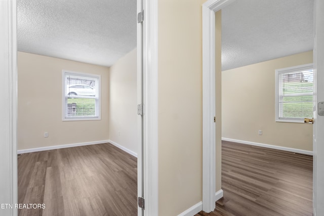 108 Burke St, Pennington Gap, VA 24277 - hallway with baseboards, wood finished floors, and a textured ceiling