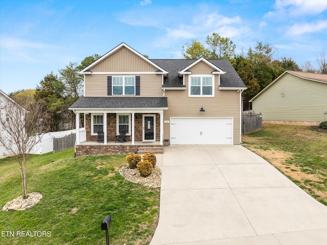 traditional-style house featuring driveway, fence, covered porch, a front yard, and a garage