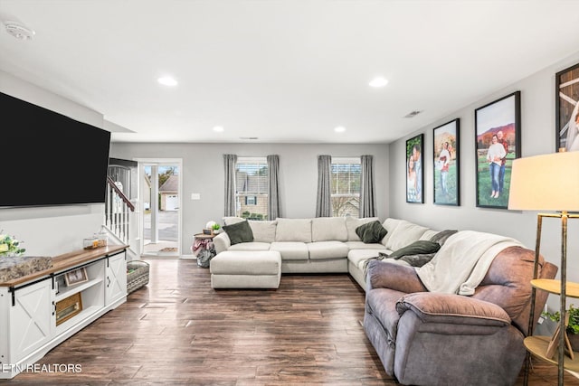 living room with visible vents, recessed lighting, stairs, and dark wood-style flooring