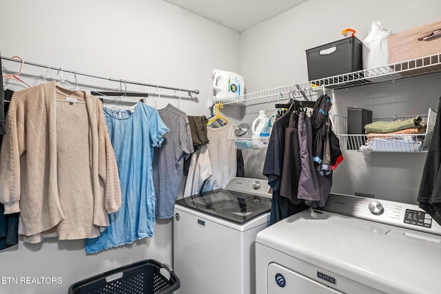 laundry room featuring laundry area and washer and clothes dryer