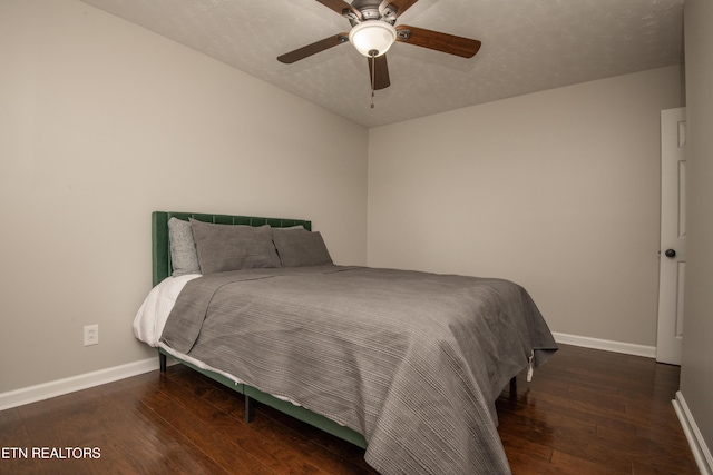 bedroom featuring baseboards, a ceiling fan, and hardwood / wood-style floors