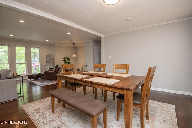 dining room with recessed lighting, crown molding, baseboards, and hardwood / wood-style flooring