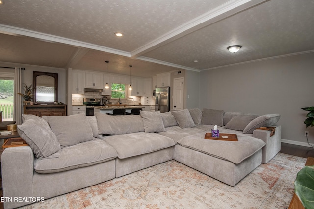 living area featuring ornamental molding, baseboards, recessed lighting, and light wood-style floors