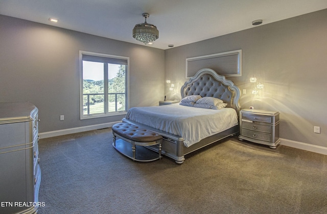 bedroom with carpet flooring and baseboards