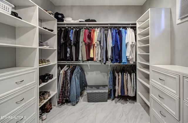 spacious closet with marble finish floor