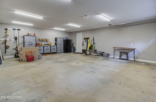 garage featuring baseboards